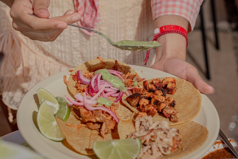 Cafe Rio Street Chicken Tacos with fresh lime and onion